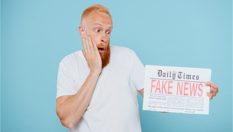 man looking at newspaper
