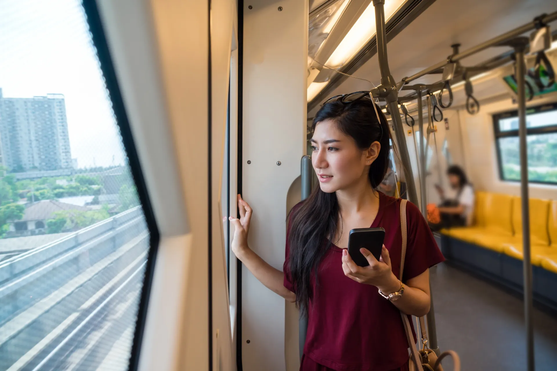 woman standing in a train
