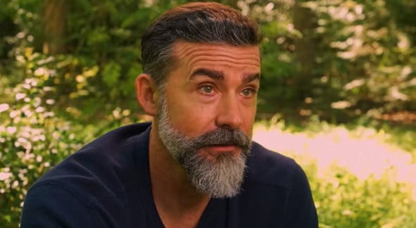 man in plaid shirt