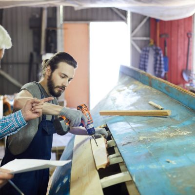 Two men working on a boat