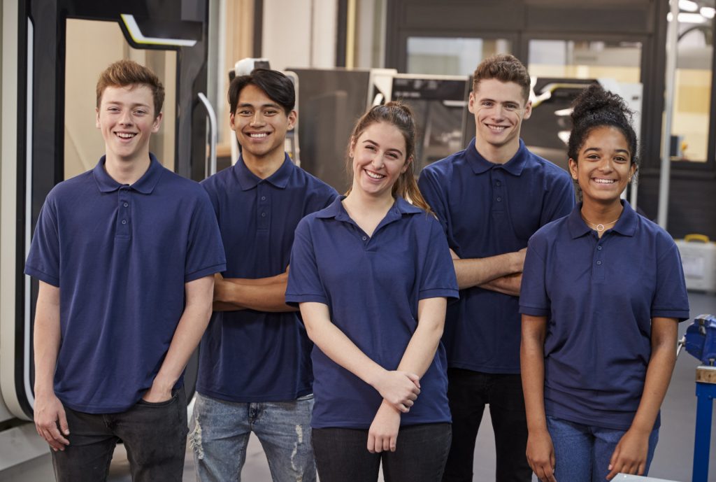 5 young people in blue shirts