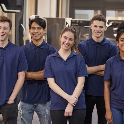 5 young people in blue shirts