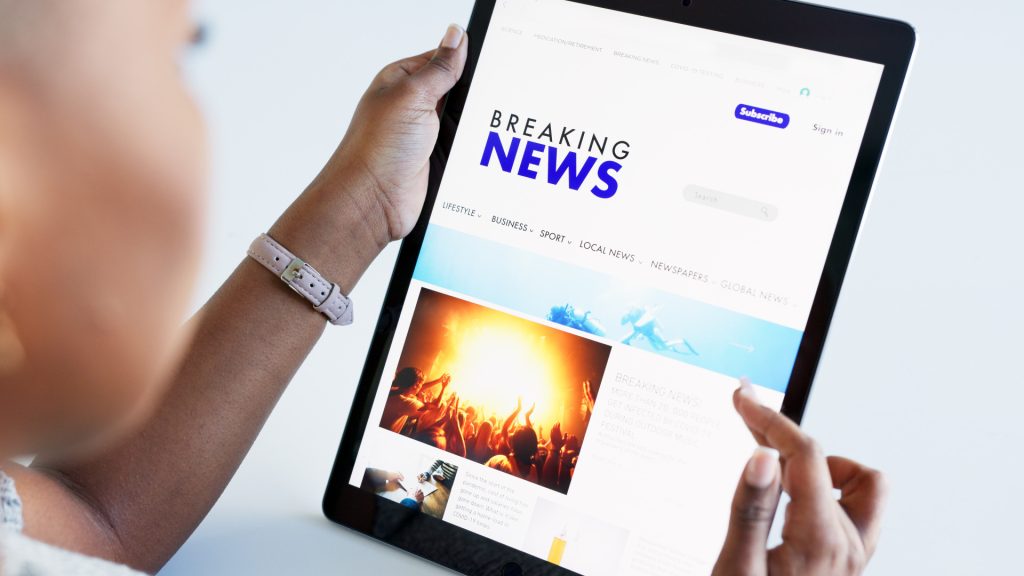 hands tablet and news with a woman reading on a w 2025 04 06 11 34 33 utc