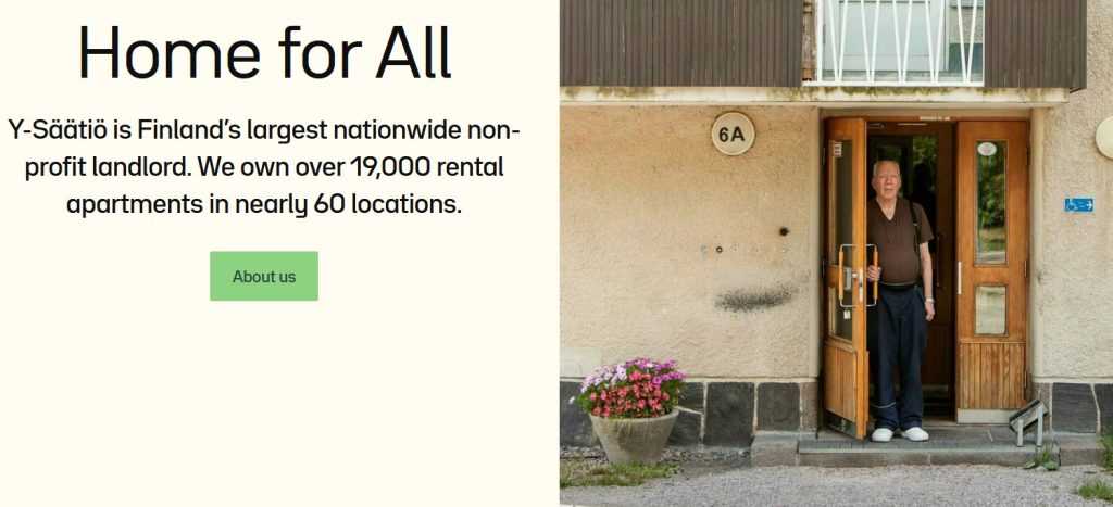 Alt title: Small housing unit in Finland
Alt text:: A man standing in a doorway.